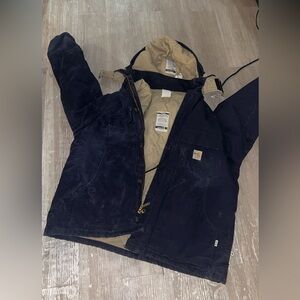 Vintage Carhartt Flame-Resistant Duck Traditional Coat in the color navy blue